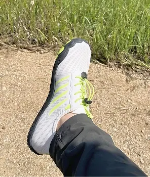 Grounded Footwear customer wearing white barefoot shoes outdoors